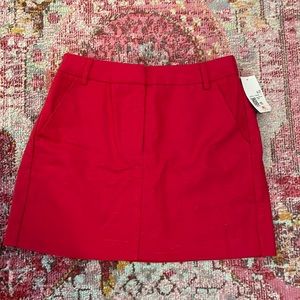 Red mini skirt with pockets never been worn